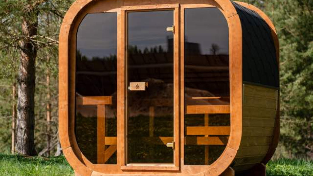 Outdoor barrel sauna at a wellness facility
